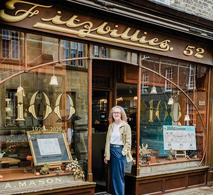 Fitzbillies owner Alison Wright stands in front of a Cambridge city Fitzbillies cafe